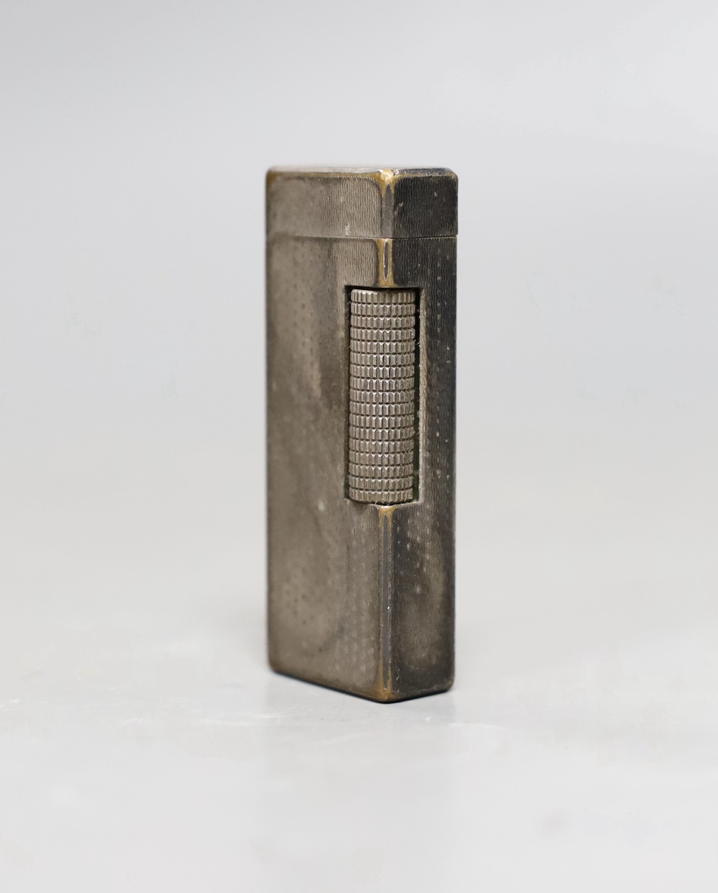 A Dunhill silver plated lighter, 6.5cms high
